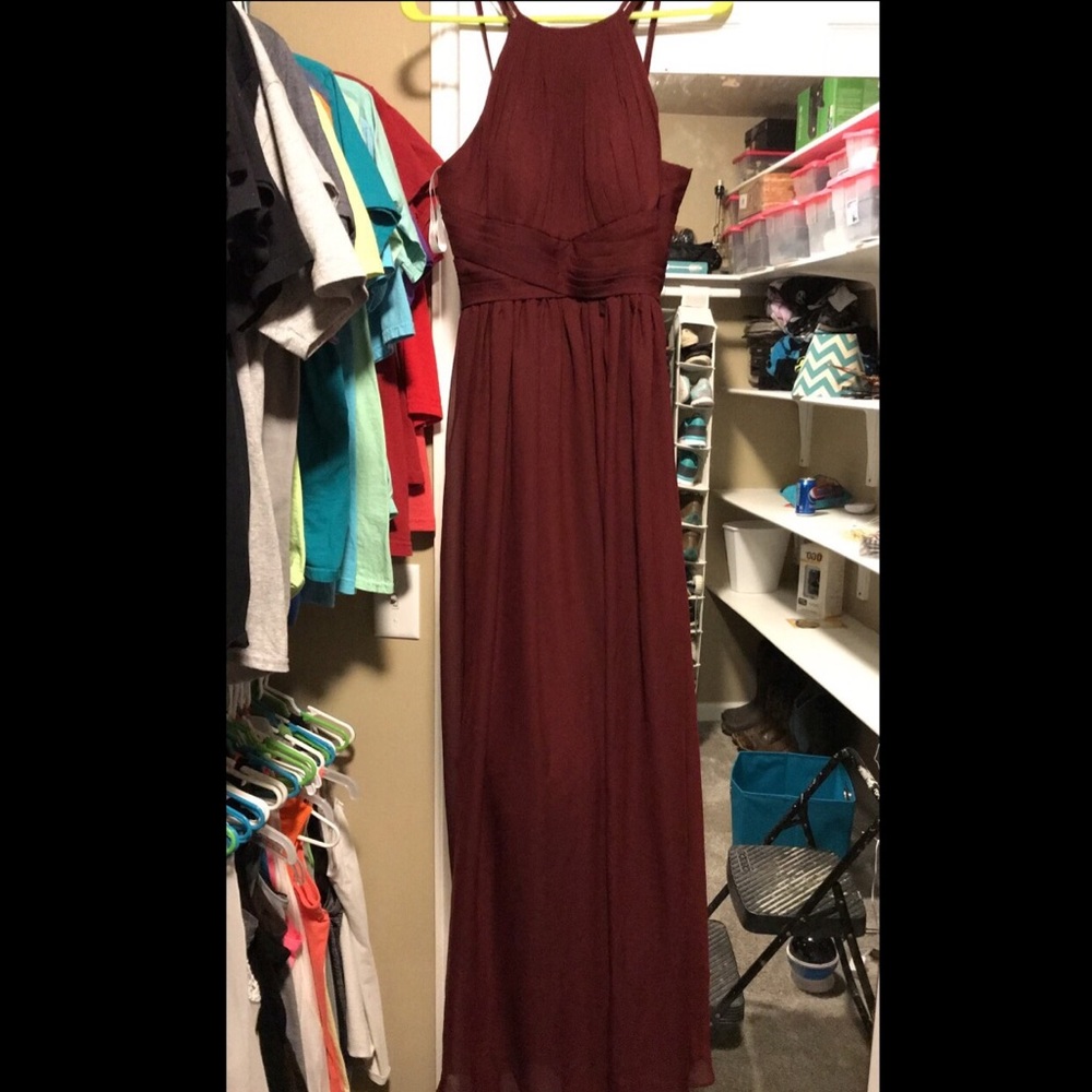 Long burgundy dress. Has padding in the boobs.